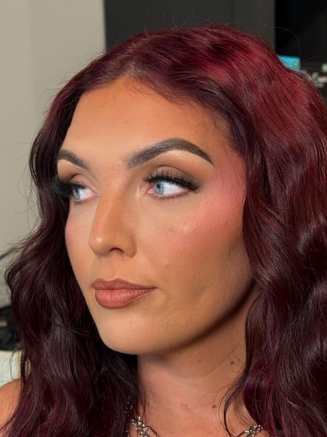 Editorial glam on burgundy curls